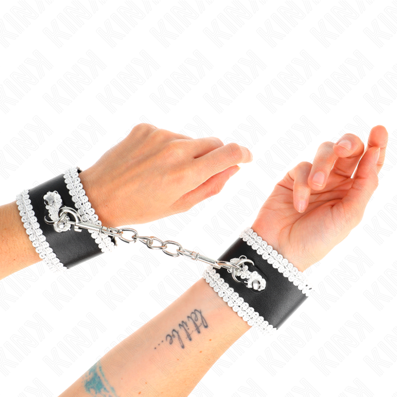 KINK - BLACK WRIST RESTRAINTS WITH WHITE DECORATED TIP, ADJUSTABLE 20-23 CM X 5.5 CM